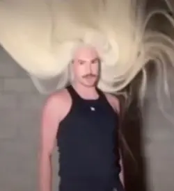 Guy flipping hair
