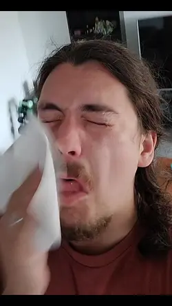 trying to wipe nose