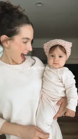 A mother is..