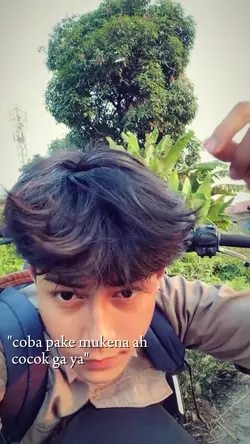 coba pake mukena ah