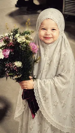 versi mukena
