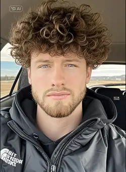 curly hair guy