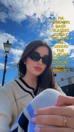 WEARING DARK GLASSES